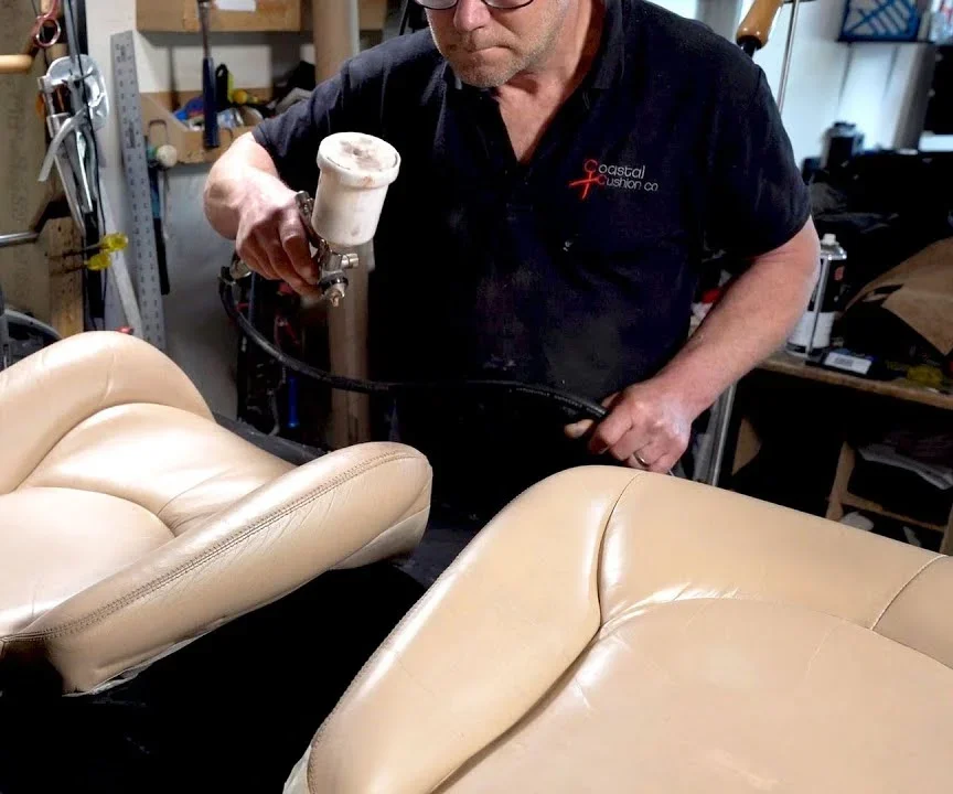 Re-colouring a leather Mercedes SL seat in the workshop